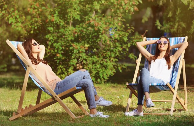 beautiful-young-women-sunbathing-park.jpg